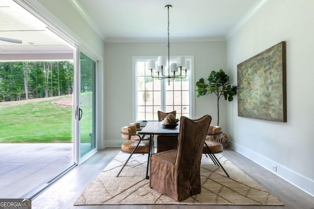 dining room featuring crown molding and a wealth of natural light