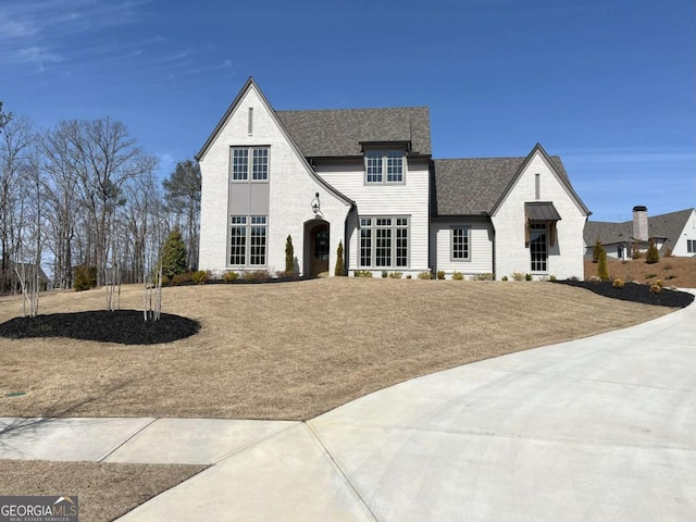 view of front of house with a shingled roof