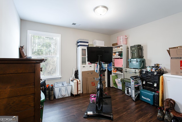 interior space featuring visible vents and dark wood-style flooring