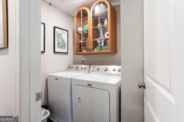 clothes washing area featuring laundry area and washing machine and dryer