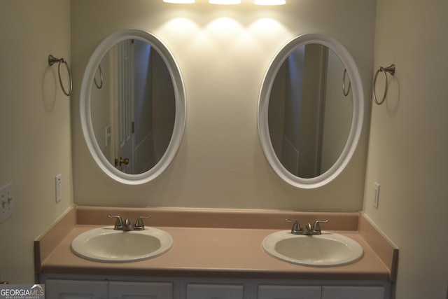 bathroom with double vanity and a sink