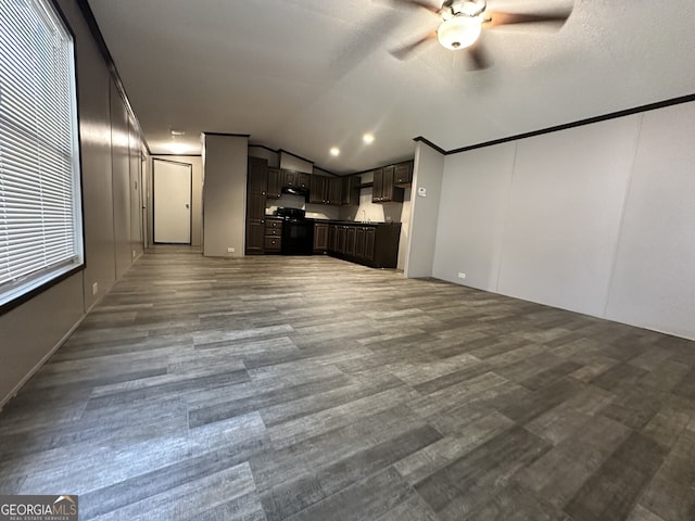 unfurnished living room featuring ceiling fan, lofted ceiling, and wood finished floors