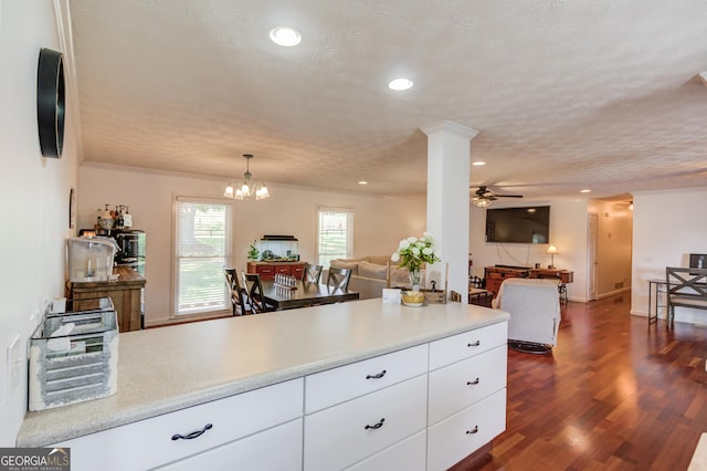 kitchen featuring dark wood-type flooring, open floor plan, recessed lighting, white cabinets, and light countertops