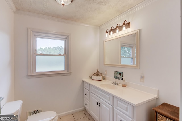 bathroom featuring visible vents, toilet, ornamental molding, tile patterned floors, and vanity