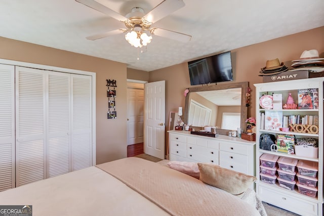 bedroom featuring a closet and a ceiling fan