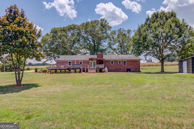 view of front of property with crawl space, a chimney, a deck, and a front yard