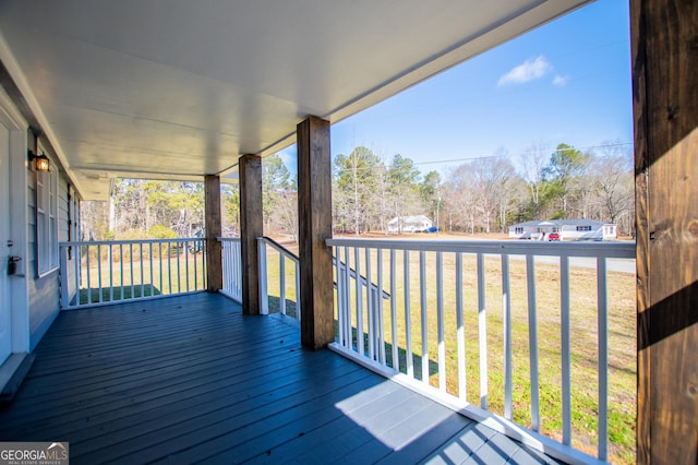 wooden deck with a yard