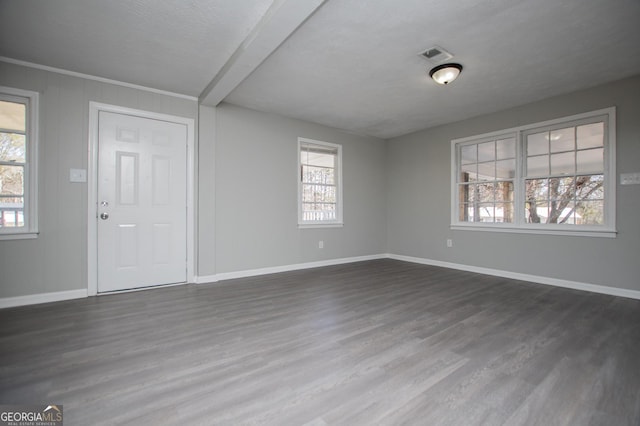 entryway with visible vents, baseboards, and dark wood-type flooring