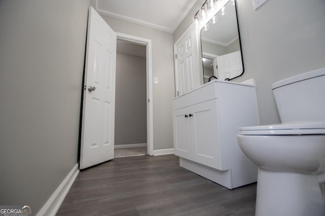 bathroom with wood finished floors and baseboards