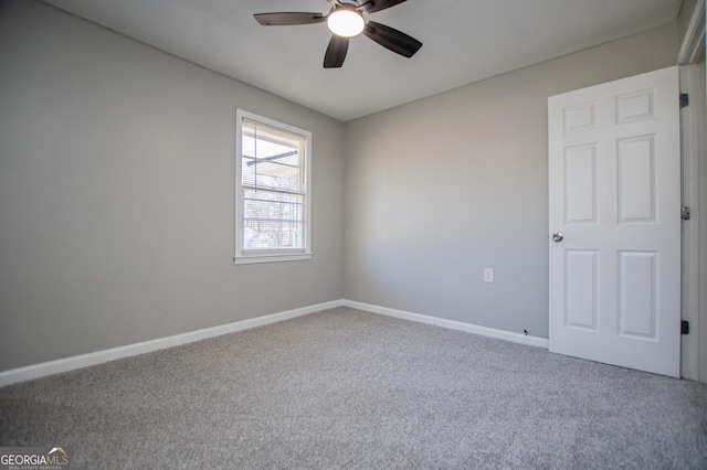 unfurnished room featuring ceiling fan, baseboards, and carpet floors