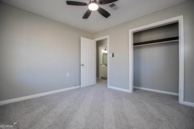 unfurnished bedroom featuring visible vents, a ceiling fan, a closet, carpet, and baseboards