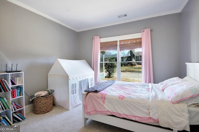 carpeted bedroom featuring visible vents and crown molding