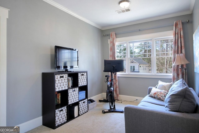 carpeted living area with visible vents, baseboards, and crown molding