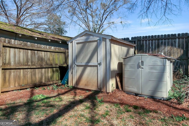 view of shed with a fenced backyard