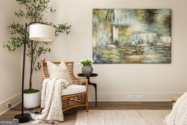 sitting room featuring wood finished floors and baseboards