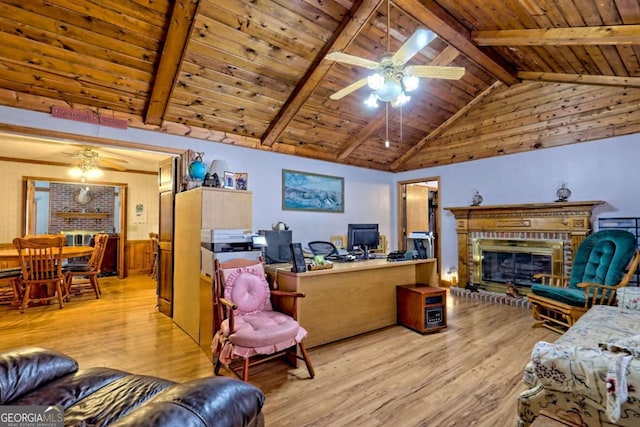 living room featuring light wood-style flooring, wood ceiling, lofted ceiling with beams, and a ceiling fan