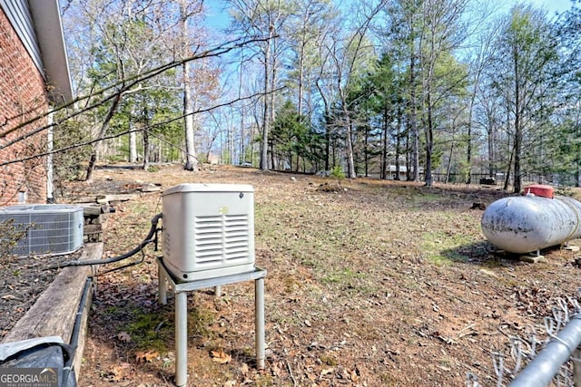 view of yard featuring central AC