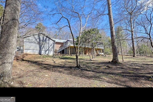 exterior space with stairs and a wooden deck