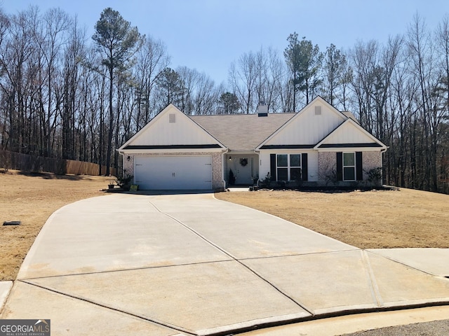 ranch-style house with brick siding, a chimney, concrete driveway, and a garage