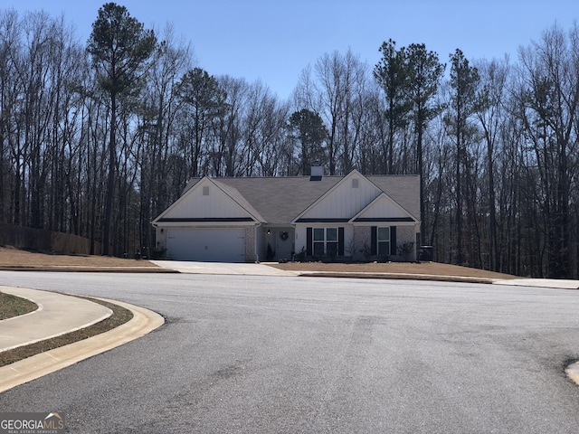 view of front of house with a chimney and a garage