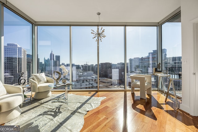 sunroom featuring a city view