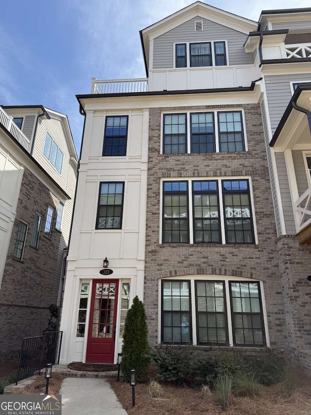 view of front of property featuring brick siding