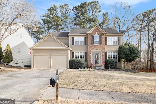 view of front of house with brick siding, an attached garage, concrete driveway, and a front lawn