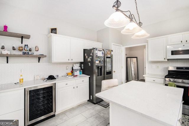 3550 Myrtlewood Chase NW, Kennesaw, GA 30144 - kitchen featuring appliances with stainless steel finishes, beverage cooler, backsplash, and light countertops