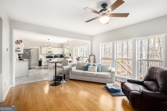 3550 Myrtlewood Chase NW, Kennesaw, GA 30144 - living room with a ceiling fan and light wood-style floors