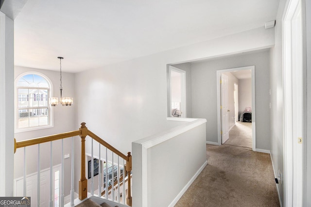 3550 Myrtlewood Chase NW, Kennesaw, GA 30144 - hall with an upstairs landing, carpet floors, and a chandelier