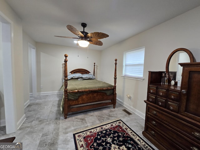 bedroom with visible vents, baseboards, and ceiling fan