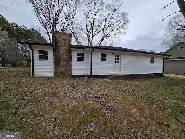 exterior space featuring a chimney