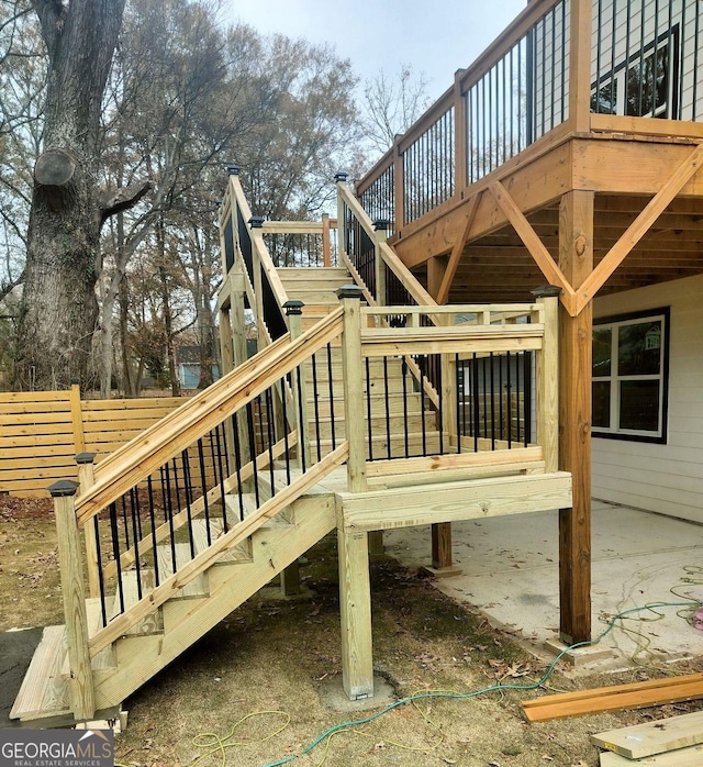 wooden terrace featuring stairs