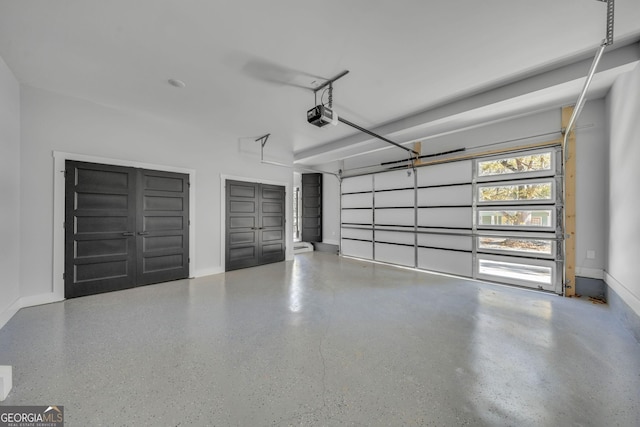 garage featuring baseboards and a garage door opener