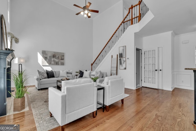 1654 Summersweet Ln, Dacula, GA 30019 - living area featuring a high ceiling, ceiling fan, wood finished floors, and stairway