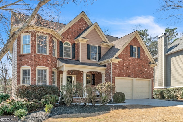 view of front facade with brick siding, concrete driveway, a garage, and a shingled roof