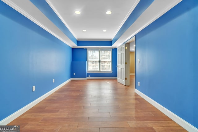 1654 Summersweet Ln, Dacula, GA 30019 - unfurnished room featuring a tray ceiling, wood finished floors, crown molding, and recessed lighting