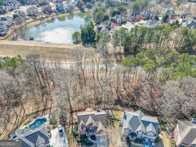 1654 Summersweet Ln, Dacula, GA 30019 - aerial view of property and surrounding area featuring nearby suburban area and a large body of water