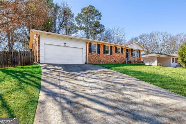 ranch-style house featuring brick siding, fence, a front yard, crawl space, and an attached garage