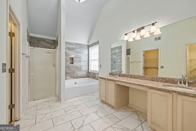 bathroom featuring visible vents, marble finish floor, a shower stall, and a sink