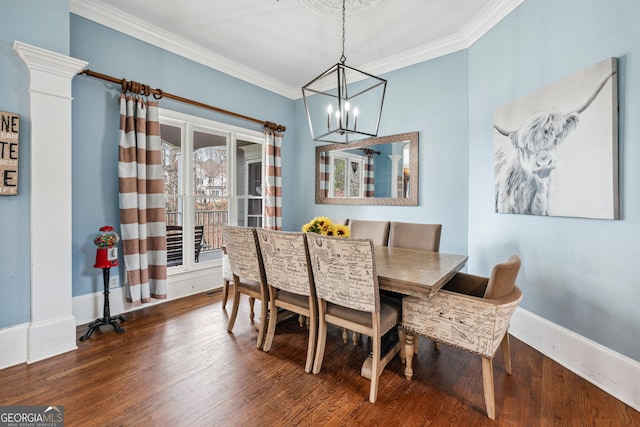 dining space with ornamental molding, baseboards, and wood finished floors