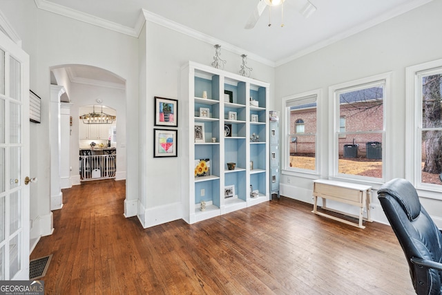 home office featuring visible vents, arched walkways, dark wood-style floors, and crown molding