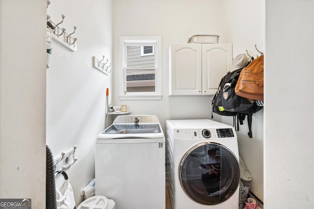 laundry area with cabinet space and washer and dryer