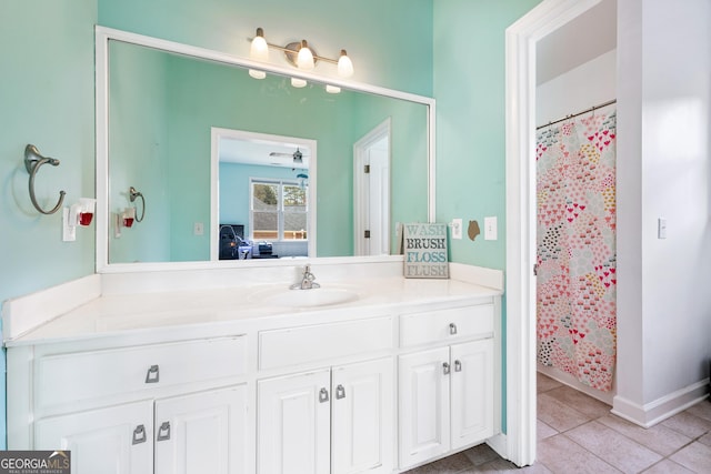 full bath with vanity and tile patterned floors