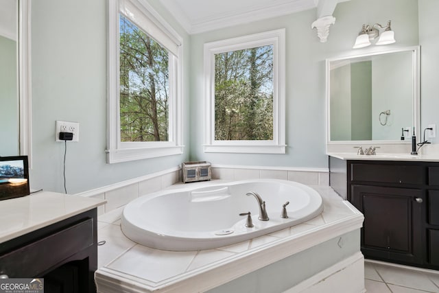 bathroom featuring vanity, tile patterned floors, a bath, and ornamental molding