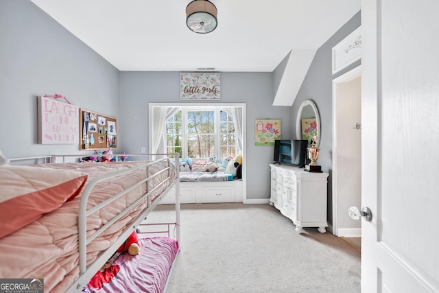 bedroom with light carpet, visible vents, and baseboards