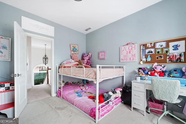 bedroom with visible vents and light carpet