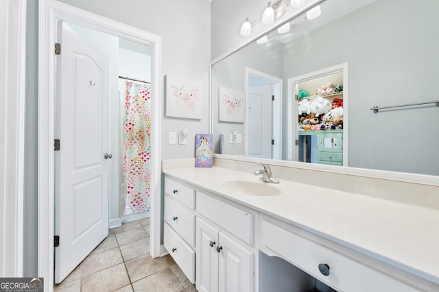 full bathroom featuring tile patterned floors and vanity