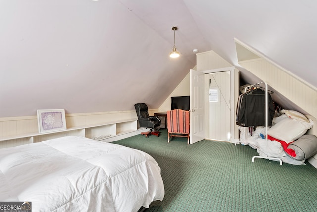 bedroom with vaulted ceiling and carpet