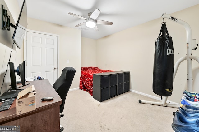 home office featuring carpet flooring, baseboards, and ceiling fan